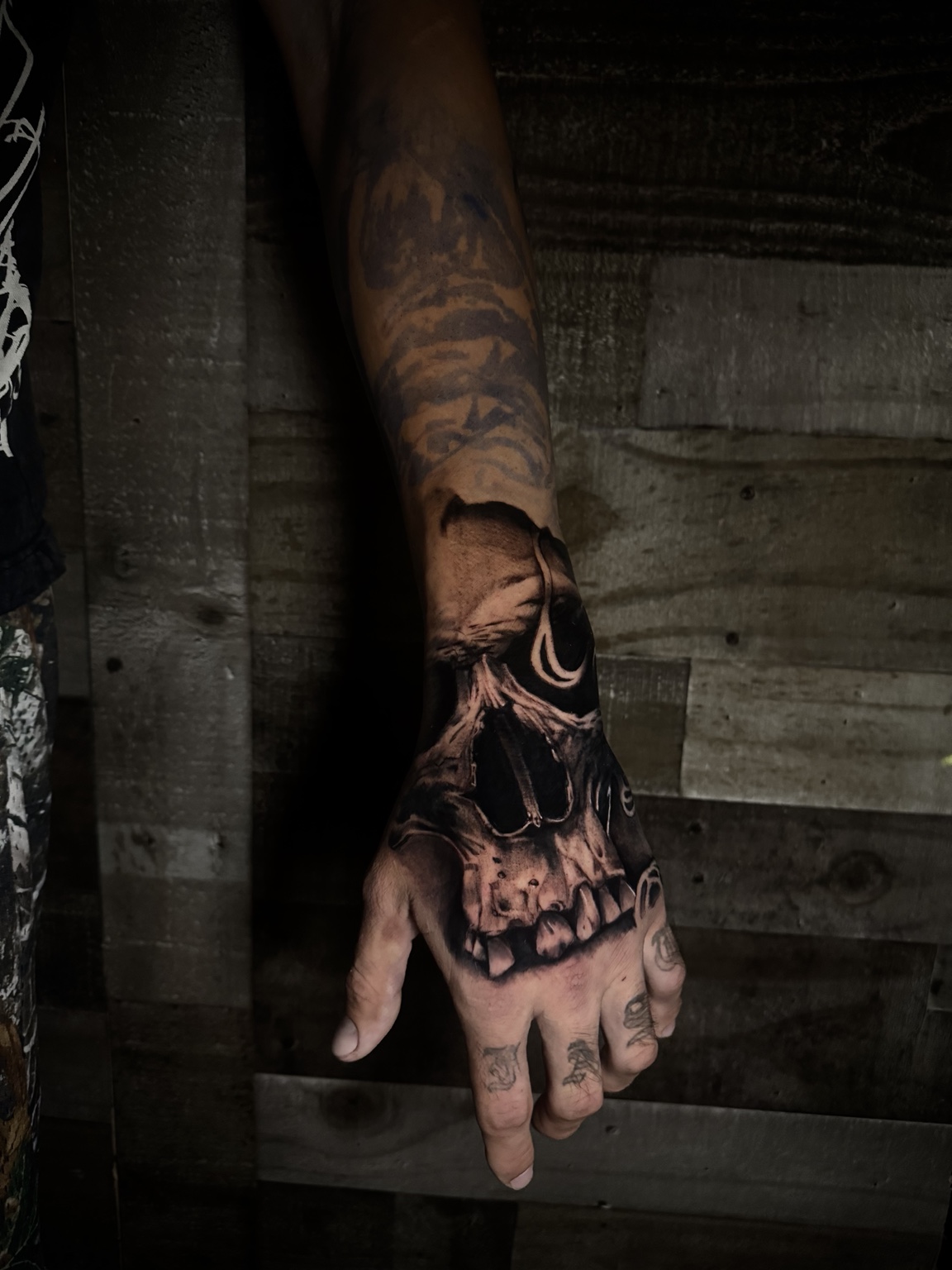 Dark hand tattoo